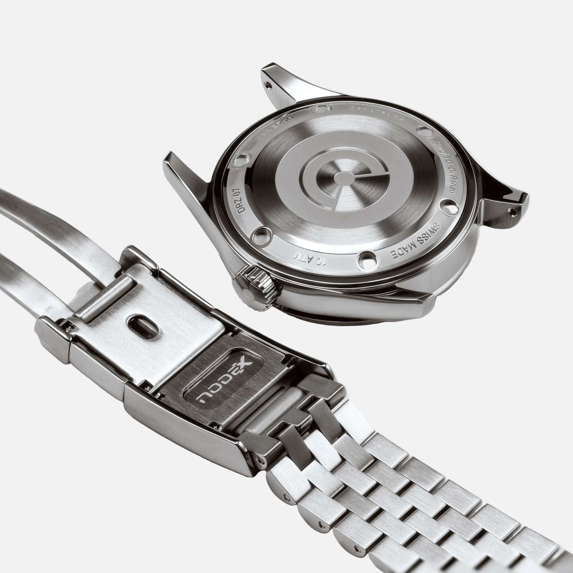 Close-up of a silver watch with a detailed case and metal band on a white background