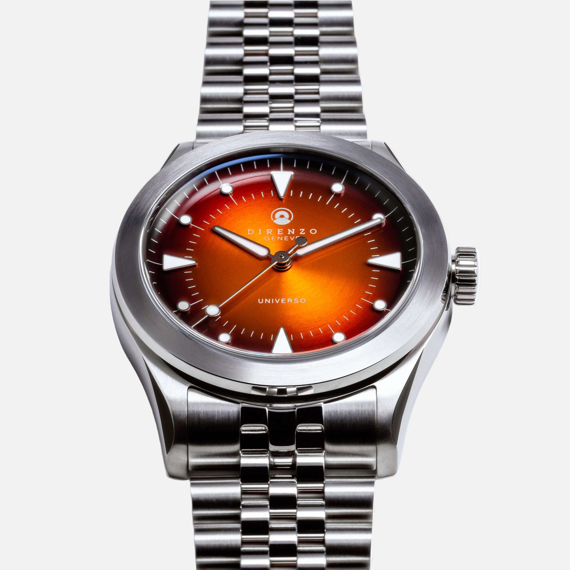Silver watch with a red-orange dial on a white background